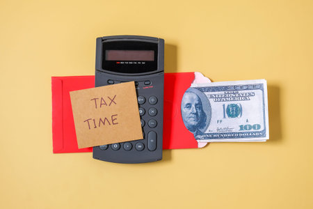 Note tax time on Banknote cash in the red envelope , US dollar concept .