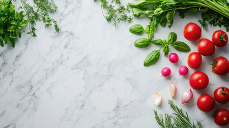 A flat lay of spring vegetables and herbs on a marble surface, with ample space for text.の素材
