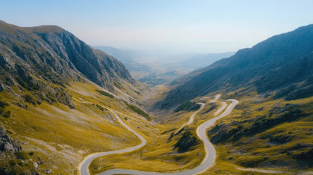 Top view of a mountain pass with winding roads, clear sky for adding copyの素材