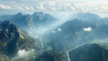 Bird's-eye view of a mountain range with a river winding through, ample space in the sky for textの素材