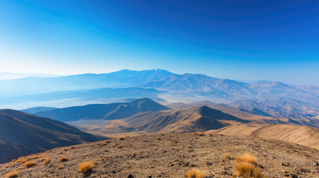 Top view of a mountain plateau with clear blue sky, ideal for adding copyの素材