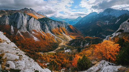 Overhead view of a mountain valley with autumn colors, with open sky for textの素材