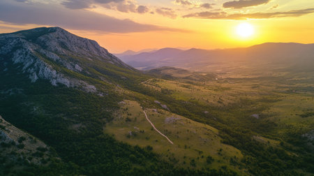 Overhead view of a mountain landscape at sunset, with open sky for textの素材