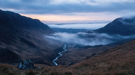 Overhead view of a mountain valley at dawn, with ample space for adding text in the skyの素材