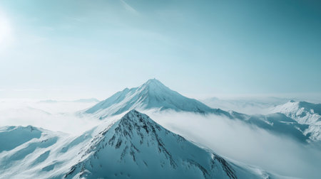 Top view of a snow-covered mountain with a large expanse of sky, perfect for adding copyの素材