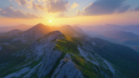 Overhead view of a mountain landscape at sunset, with open sky for textの素材