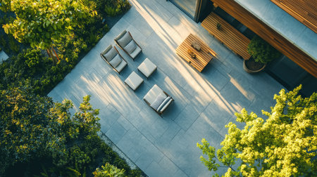 Top view of a stylish contemporary home with outdoor seating, perfect for real estate copyの素材