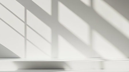 A minimalist white background with subtle shadows, ideal for product placement or text overlaysの素材