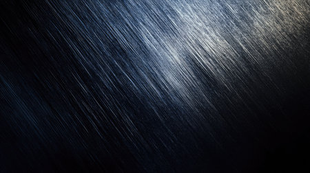 A dark, metallic background with a brushed texture, perfect for industrial and modern designsの素材