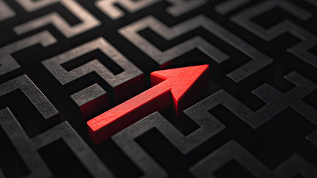 A top view of a red arrow cutting through the twists and turns of a black maze, representing strategic direction and progressの素材