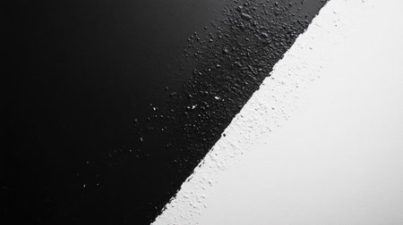 Top view of a black and white abstract background with plenty of copy space on the left side.の素材
