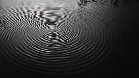 Top view of a black and white abstract ripple pattern with ample copy space on the left side.の素材