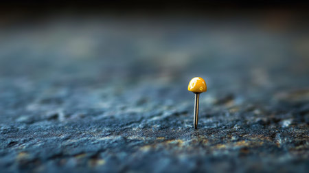 Close-up of a pin on a surface, with ample copy space available, showcasing detail and sharpnessの素材