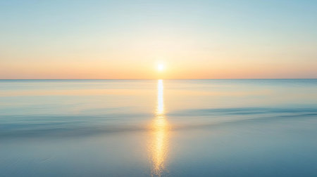 Early morning sun rising over a calm horizon, casting light and shadows with ample copy space. No people, tranquil settingの素材