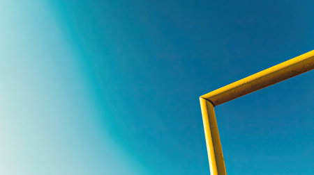 Close-up of a football field goal post, clear sky in the background, with space for textの素材