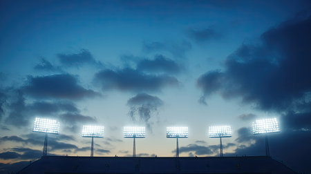 Detailed shot of stadium floodlights, no audience, wide open sky with room for copy or logoの素材