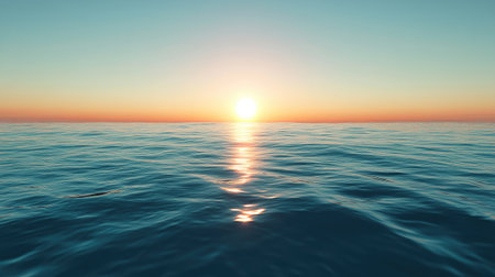 A calm sea with the sun setting in the distance, creating a perfect space for text. No people.の素材