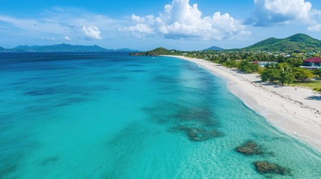 Discover a breathtaking tropical beach characterized by turquoise waters and white sand, framed by lush greenery and dramatic clouds for a perfect getaway.の素材