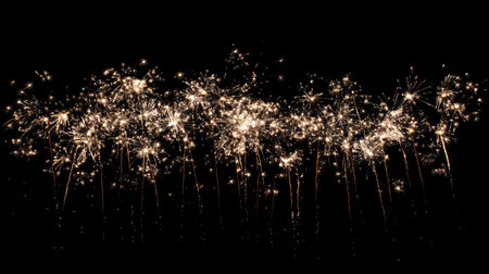 A stunning display of sparkling fireworks illuminating the night sky, creating a festive atmosphere perfect for celebrations and special events.の素材