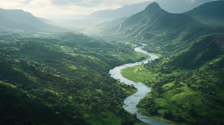 African river flowing through a green valley, leaving ample room for textの素材