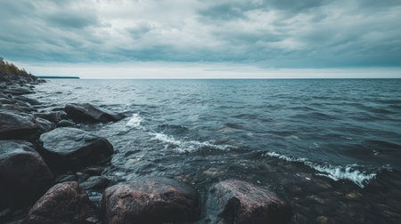 Calm waters of Lake Superior with rocky shores and space for text in the skyの素材