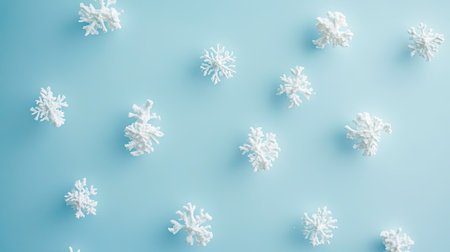 Minimalist snowflakes on soft pastel blue background, blank space for copyの素材
