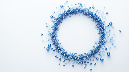 Blue circle made from small beads on white background, representing diabetes awareness with space for messagingの素材