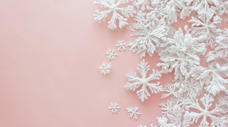 A beautiful and serene collection of white snowflakes on a soft pink background, ideal for winter themes, festive designs, and seasonal decor.の素材