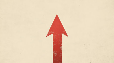 A vintage red arrow pointing upwards against a textured cream background, representing progress, growth, and positive direction in various creative and business projects.の素材
