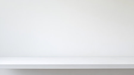 A spacious minimalist white background showcasing an empty shelf, perfect for creative projects, product displays, or modern interior design concepts.の素材