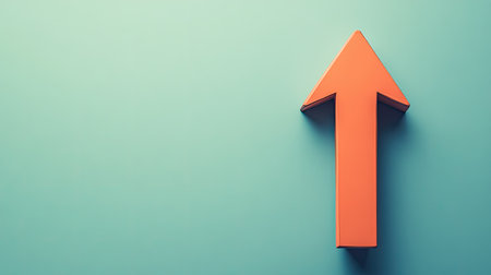 A vibrant orange arrow pointing upward against a soft blue background, symbolizing growth and direction in a clean and modern design suitable for various creative projects.の素材