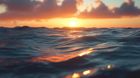 A stunning view of the ocean at sunset, showcasing gentle waves under a colorful sky with soft clouds and warm reflections. Perfect for nature lovers and peaceful moments.の素材