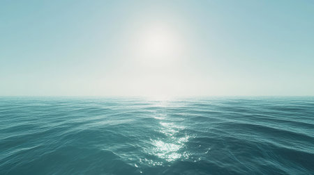 A tranquil ocean scene showcasing gentle waves under bright sunlight and a clear blue sky, evoking a sense of peace and natural beauty perfect for relaxation and inspiration.の素材