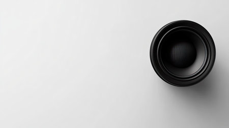 A sleek black speaker on a white background, ideal for showcasing audio technology and design. Perfect for music-related projects, minimalist aesthetics, and home audio setups.の素材