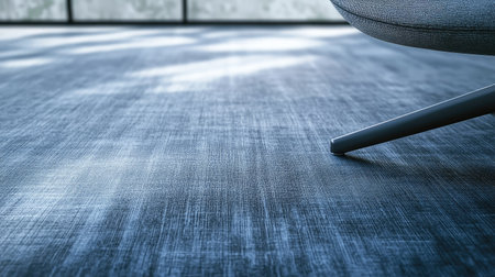 A cozy living space featuring a soft textured floor and a stylish chair, beautifully lit by natural light, inviting relaxation and comfort in an elegant, minimalist design.の素材