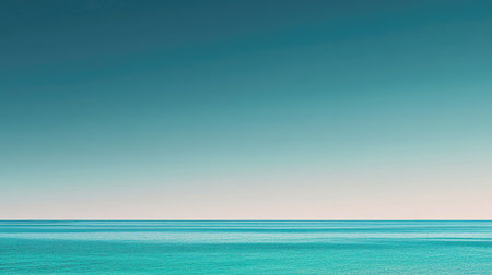This serene seascape captures a tranquil ocean view under a clear blue sky, ideal for evoking peace and relaxation in various creative projects or backgrounds.の素材