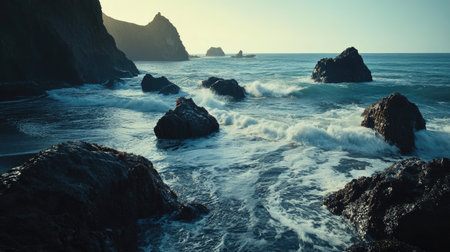 Captivating coastal scene featuring rocky formations bathed in sunset light, gentle waves crashing against the shore, creating a peaceful and serene atmosphere in nature.の素材