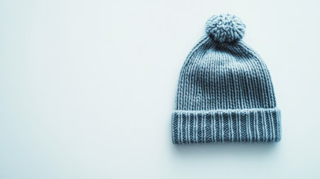 This cozy gray knit beanie hat features a playful pom-pom and is perfect for chilly days. Ideal for casual outings or stylish winter looks.の素材