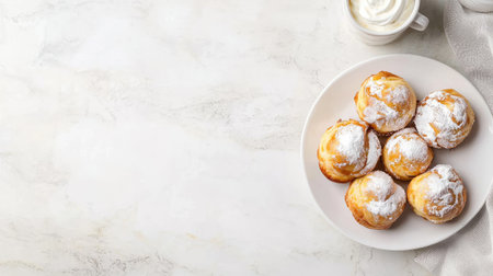 A delectable arrangement of sweet muffins dusted with powdered sugar, served with a cup of creamy topping, showcasing a cozy food moment.の素材