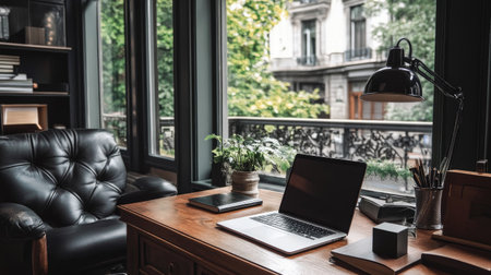 A stylish modern workspace featuring a laptop on a wooden desk, surrounded by plants and natural light, creating a serene and productive atmosphere.の素材