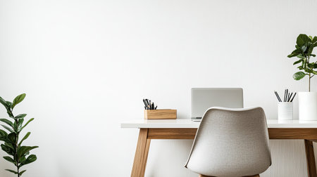 A stylish minimalist workspace featuring a sleek desk with a laptop, potted plants, and elegant decor. Perfect for inspiration and productivity in any setting.の素材