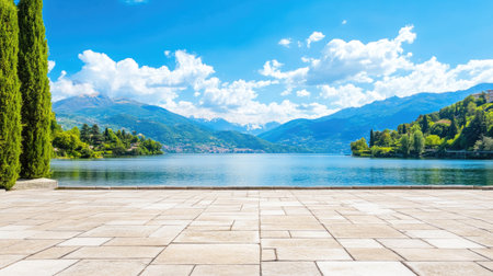 A stunning lakeside scene featuring serene waters, majestic mountains, and a vibrant sky filled with fluffy clouds. Perfect for travel and nature enthusiasts.の素材