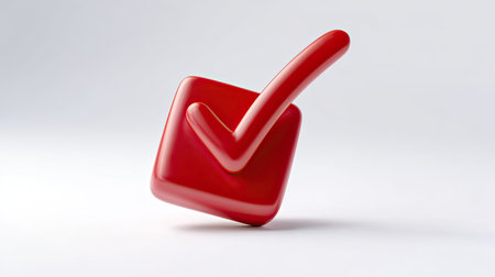 This image features a shiny red checkmark symbol resting atop a soft gray surface, symbolizing approval and positive validation in business or personal contexts.の素材