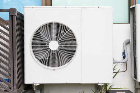 air conditioners installation outside of building near   glass windows