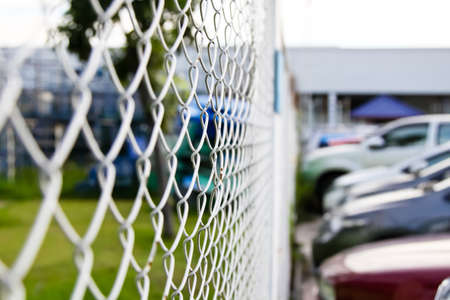 Steel net fence with blur backgroundの写真素材