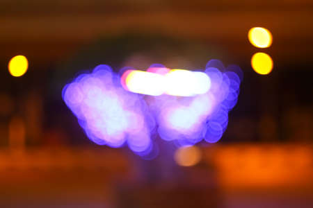 Colourful defocused lights on dark backgroundの写真素材
