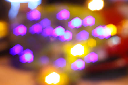 Colourful defocused lights on dark backgroundの写真素材