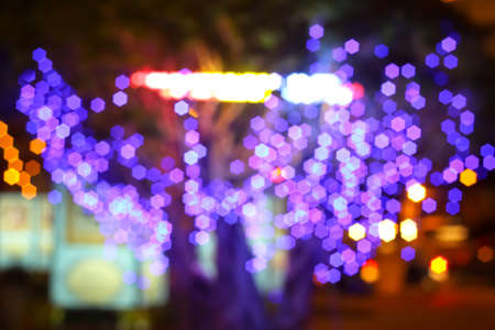 Colourful defocused lights on dark backgroundの写真素材