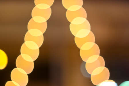 Colourful defocused lights on dark backgroundの写真素材