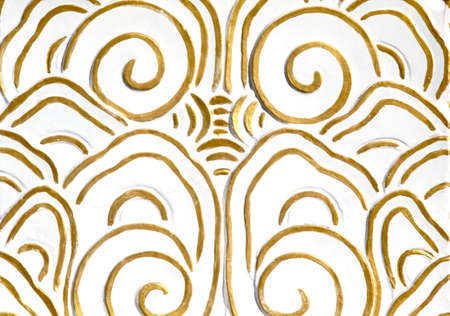 an ancient gold ornament on a white backgroundの写真素材